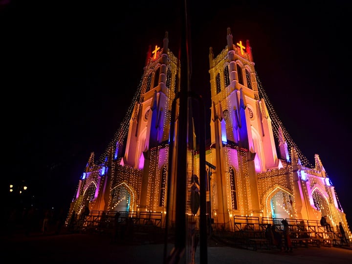 Illuminated Christ Church ahead of the Christmas festival, in Shimla. In a first as per the living memory of old-timers, there will be no traditional Christmas religious services like midnight Mass and pealing of the bell in the neo-Gothic style Anglican Christ Church on Shimla's Ridge in the time of the Coronavirus pandemic. (Image: PTI)