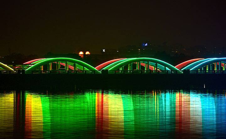 Napier bridge gets dynamic lighting system to mark new yer celebration ,in Chennai. The government had announced that all hotels, bars, pubs in Chennai city and other cities and towns will shut at 10pm.Image (PTI)