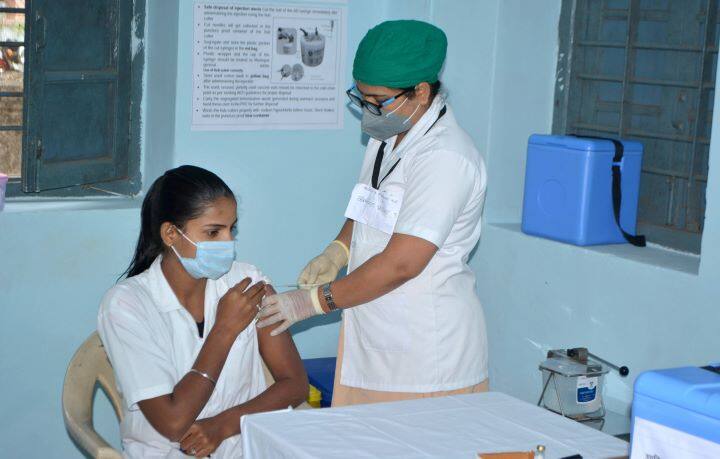 All participating districts identifIED three types of sessions for the mock drive: district hospital, medical college/private health facility, urban/rural outreach. 
A Health worker takes part in the dry run for the administration of Covid vaccine at Venutai Chavan Government Hospital in Karad. (Image: PTI)