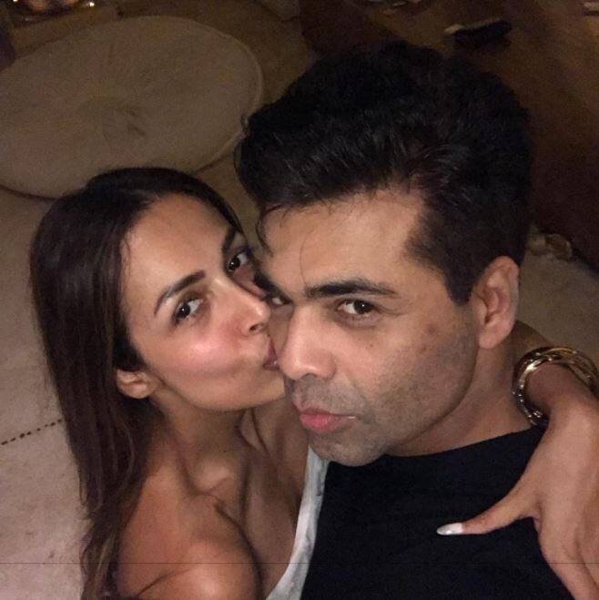 फिल्मों से दूर स्टार पार्टी की जान मलाइका अरोड़ा करण जौहर को किस करते हुए.