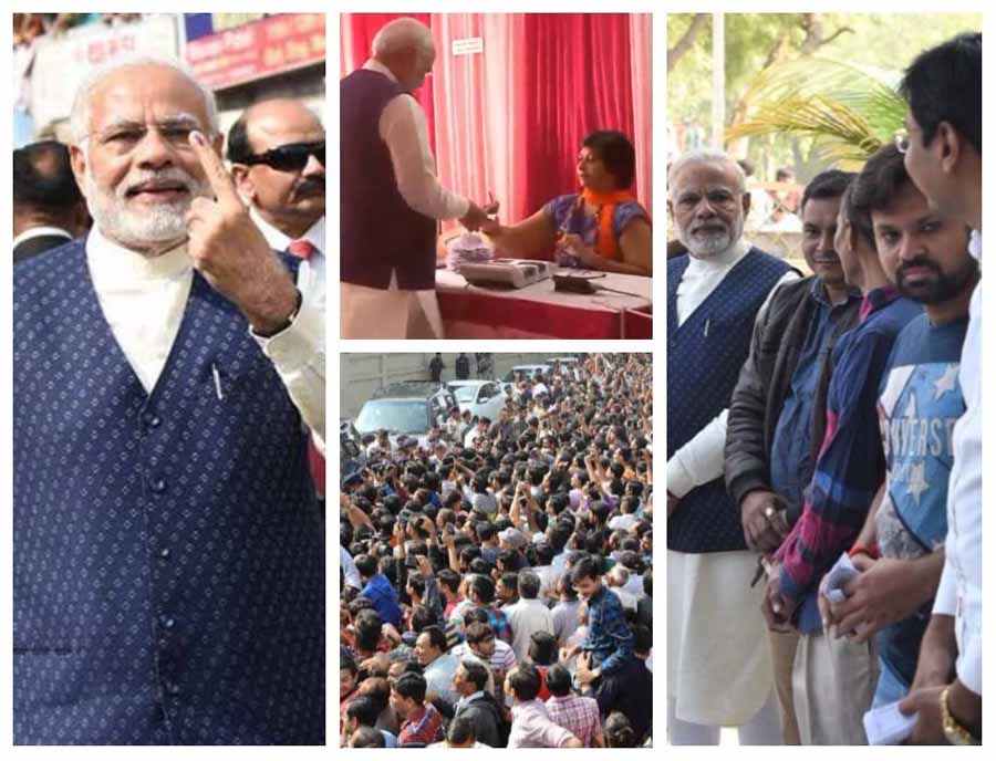 तस्वीरों में: लाइन में लगकर प्रधानमंत्री  ने डाला वोट, भीड़ ने लगाए मोदी-मोदी के नारे