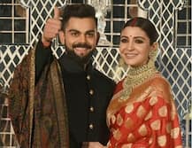 VIDEO: रिसेप्शन में हाथों में हाथ डाले स्टेज पर पहुंचे विराट-अनुष्का, उन्हें देख थमी लोगों की निगाहें