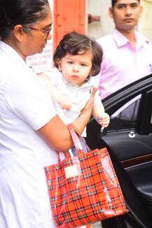 कैमरे को पोज देते तैमूर अली खान की तस्वीरों ने बटोरी सुर्खियां, देखें