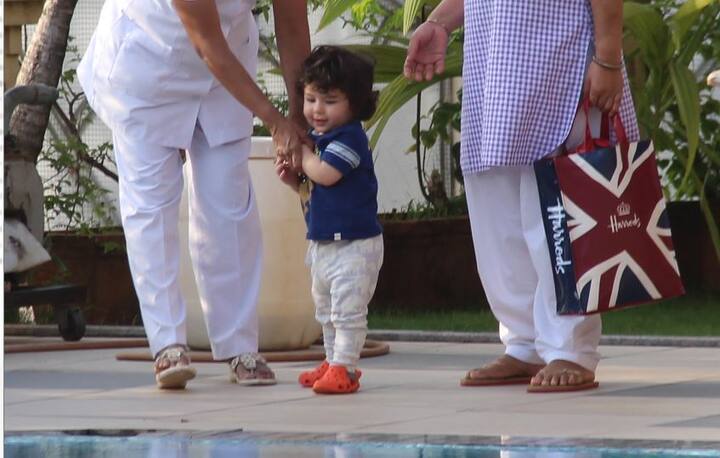 तैमूर तमाम कोशिश कर रहे हैं कि वो नैनी से हाथ छुड़ाकर वापस भाग जाएं लेकिन अफसोस इस बार उनकी ये कोशिशें जरा नाकाम होती ही नजर आ रही हैं. 