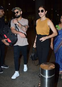 In Pics: जन्मदिन मना वापिस लौटे विरुष्का, कैमरे की नज़रों से बचते रहे