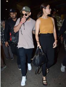 In Pics: जन्मदिन मना वापिस लौटे विरुष्का, कैमरे की नज़रों से बचते रहे