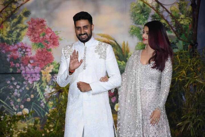 कैमरों को पोज देते अभिषेक बच्चन. इस रिसेप्शन के दौरान इस स्टार कपल की कई कैंडेड तस्वीरें क्लिक की गई हैं. (तस्वीर: मानव मंगलानी)