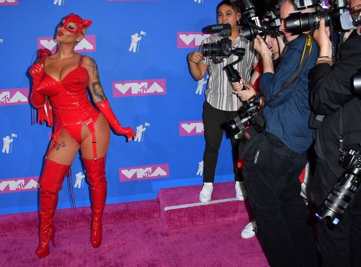 एंबर हाथ में whip लिए भी नज़र आईं. (Photo: AP, AFP, Instagram)