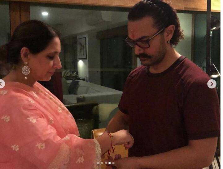 आमतौर पर राखी भाई की कलाई पर बहन बांधती है, लेकिन आमिर खान ने रक्षाबंधन पर अपनी दोनों बहनों निखत और फरहत की कलाई पर राखी बांधी. (तस्वीर: इंस्टाग्राम)