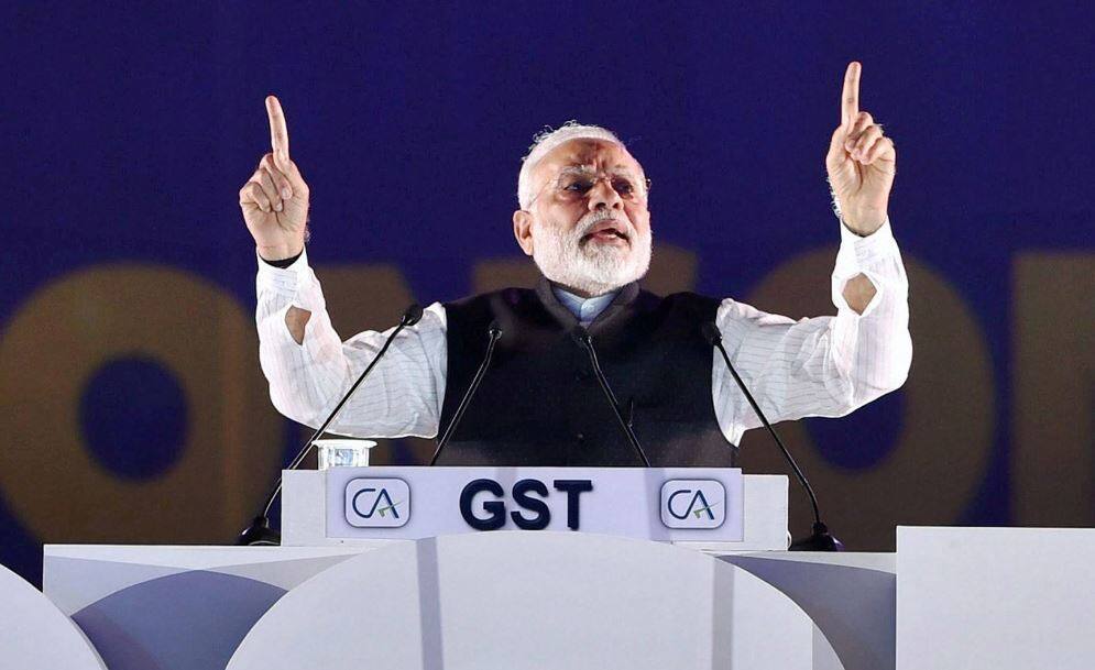 GST: पीएम ने बड़े बदलाव के संकेत दिए, 99% प्रतिशत वस्तुएं 18% या उससे कम के स्लैब में आएंगी Working to bring 99 pc items in sub-18 pc GST slab says pm modi GST: पीएम ने बड़े बदलाव के संकेत दिए, 99% प्रतिशत वस्तुएं 18% या उससे कम के स्लैब में आएंगी