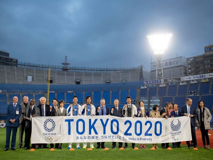 tokyo olympic organising committee & ioc conflict over postponement expense payment जापान और IOC में तकरार- ओलंपिक टलने से कौन भरेगा भारी-भरकम खर्च?