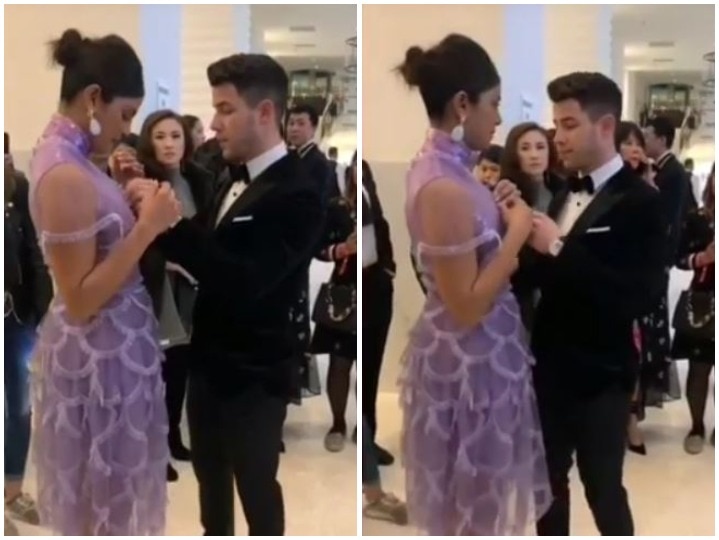 Nick Jonas escapes priyanka chopra from oops moment as he managed her dress from breast to ignore wardrobe malfunction at chopard party in cannes 2019 Cannes 2019: पार्टी में प्रियंका चोपड़ा की ड्रेस ठीक करते दिखे निक जोनास, सामने आया ये VIDEO
