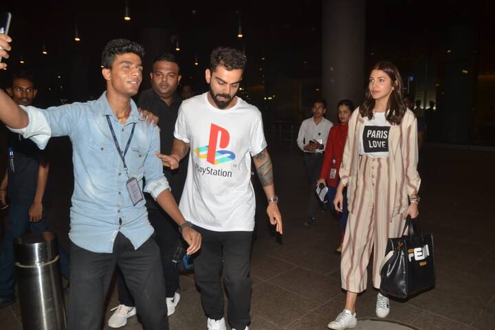 इस दौरान विराट कोहली जरा गुस्से में दिखाई दे रहे थे. फोटो में आप देख सकते हैं कि तस्वीर लेने आए फैन को विराट ने सेल्फी लेने से मना कर दिया. (तस्वीर: मानव मंगलानी)