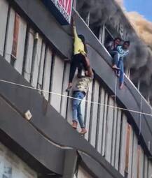 सूरत अग्निकांड की दिल दहला देने वाली तस्वीरें, बच्चों ने जान बचाने लिए चौथी मंजिल से लगाई छलांग