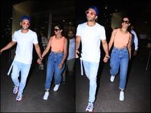 IN PICS: छुट्टियों से वापस लौटे रणवीर और दीपिका, एयरपोर्ट पर हाथों में हाथ डाले आए नजर