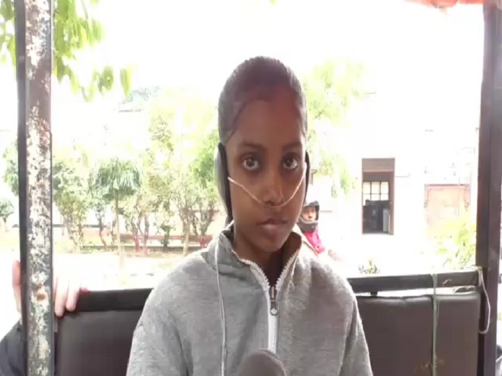 Students taking high school examination with the help of oxygen cylinder