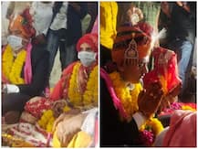 Coronavirus: लॉकडाउन के बीच निभाई गईं शादी की रस्में, दूल्हा-दुल्हन ने मास्क पहनकर लिए सात फेरे