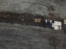 न्यूयॉर्क: एक दिन में 799 लोगों की मौत, नहर की शक्ल वाले कब्रगाहों में एक साथ कई शव दफनाए गए