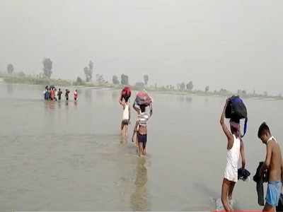 Hundreds of labourers crossing the Yamuna in Haryana and UP, risking their lives by river