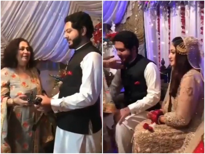 Pakistani Groom Receives AK-47 Rifle as Gift on Wedding Day Video Goes Viral on social media पाकिस्तान में महिला ने दूल्हे को गिफ्ट में दी AK-47 राइफल, वीडियो हो रहा वायरल