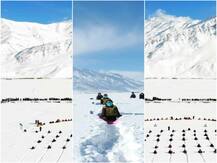 तस्वीरें: कड़ाके की ठंड में बर्फ के बीच बैठकर खिलाड़ियों और बौद्ध भिक्षुओं ने किया योग