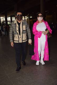 एयरपोर्ट पर पत्नी के साथ दिखे गोविंदा, पैपराजी के कहने पर दोनों ने मास्क हटाकर दिया पोज