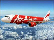 एयरएशिया की फ्लाइट में यात्री ने की बदतमीजी, क्रू के सामने उतारे कपड़े, लैपटॉप फेंका