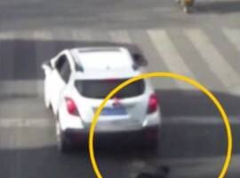 Viral Video Child Luckily Survives After Falling From Cab Being Run Over By Suv In China ক্যাব থেকে ছিটকে এসইউভি-র তলায় চাপা পড়েও বাঁচল ৬ বছরের শিশু, দেখুন ভিডিওতে