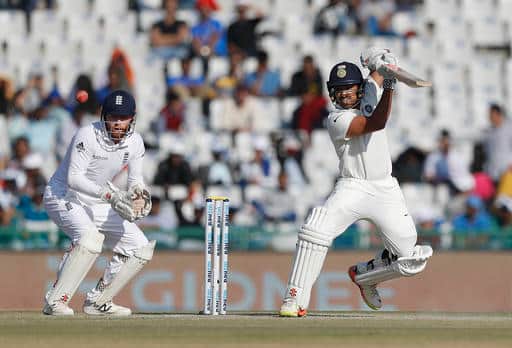 India's debutant Karun Nair plays a shot on the second day of their third cricket test match against England in Mohali, India, Sunday, Nov. 27, 2016. (AP Photo/Altaf Qadri)