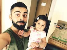 কোহলির কোলে এ কার মেয়ে!