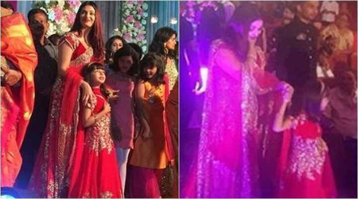 Photos: Aishwarya Rai Bachchan and daughter Aaradhya are twinning again, this time in dazzling red তুতো ভাইয়ের বিয়েতে লাল লহেঙ্গায় আলোড়ন তুললেন অ্যাশ ও কন্যা আরাধ্যা, কথা বললেন তুলু ভাষায়