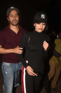 এক মহিলাকে আগলে নিয়ে গেলেন বরুণ ধওয়ান, কে সেই রহস্যময়ী? জানেন