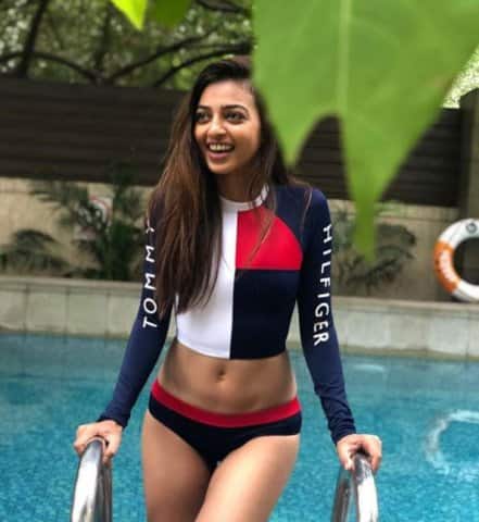 সুইমিং পুলের ধারে বিকিনি পরে হাসিমুখে রাধিকা। ছবি সৌজন্যে ইনস্টাগ্রাম