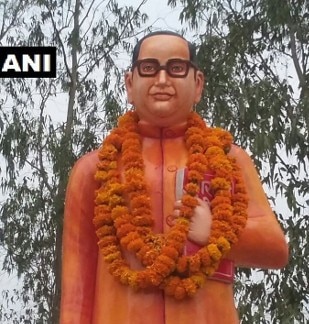 'Saffron' Ambedkar Statue Installed in Uttar Pradesh's Badaun, Opposition Cries Foul উত্তর প্রদেশে অম্বেডকরের ভাঙা মূর্তি গড়ে দিল যোগী সরকার, রং দিল গেরুয়া
