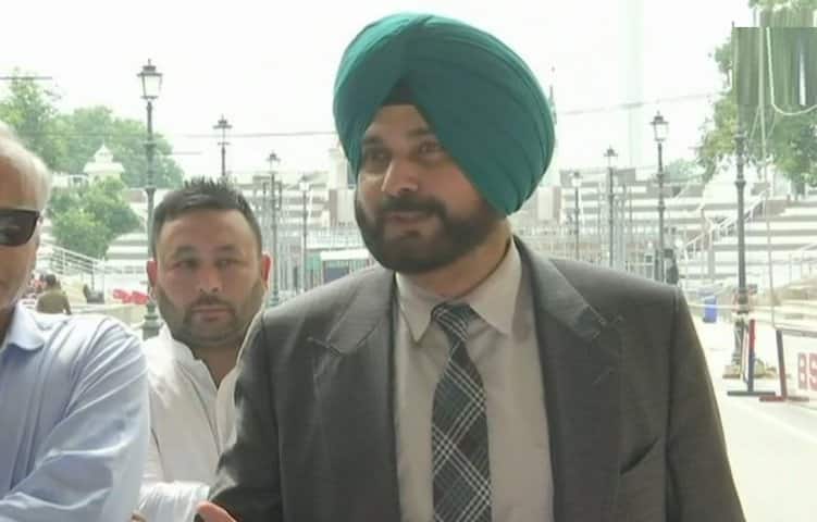 Sidhu reacts to controversy on hugging Pak Army Chief, sitting beside PoK President পাক সেনাপ্রধানকে আলিঙ্গন নিয়ে বিতর্ক, দেশে ফিরে সাফাই সিধুর
