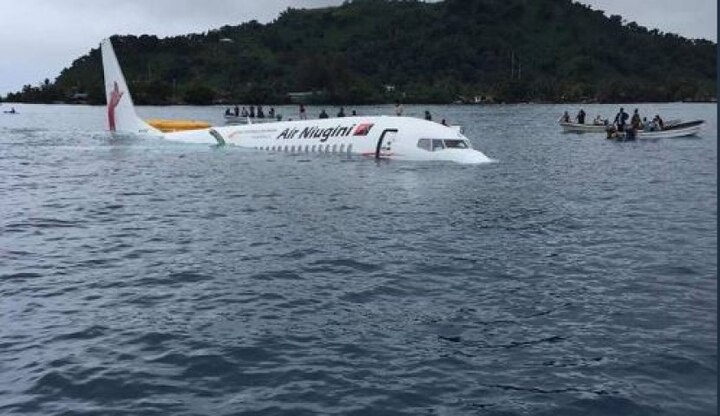 Passengers swim for life as plane overshoots runway and ditches into Pacific lagoon অবতরণের পর রানওয়ে ছাড়িয়ে হ্রদে বিমান, সাঁতরে প্রাণ বাঁচালেন যাত্রীরা