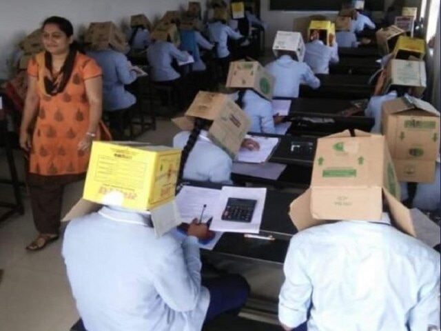 Karnataka Students Made To Wear Cartons To Avoid Copying যদি টুকলি করে! কার্ডবোর্ডের বাক্স মাথায় পরিয়ে পরীক্ষা দিতে বাধ্য করা হল কর্নাটকের পড়ুয়াদের