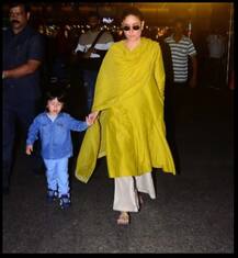 এয়ারপোর্টে মা-বাবার সঙ্গে তৈমুর, দেখুন ক্যামেরা দেখে কী করল ছোট্ট নবাব