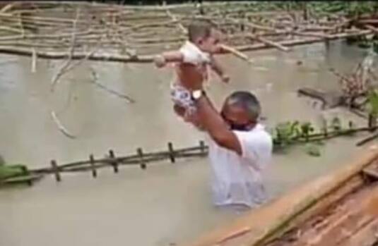 Assam MLA Wades Through Waist-Deep Water To Help Those Stranded In কোমর সমান জলে নেমে বন্যায় বিপন্ন মানুষকে উদ্ধার অসমের বিধায়কের