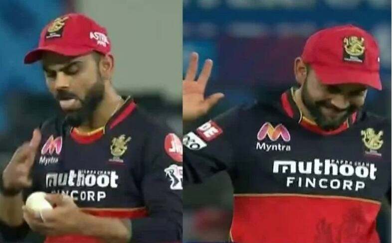 IPL 2020: WATCH- Virat Kohli almost applies saliva on the ball, realizes just in time বহুদিনের অভ্যেস! নিয়ম ভেঙে বলে থুতু প্রায় লাগিয়ে ফেলেছিলেন কোহলি, কী বললেন সচিন