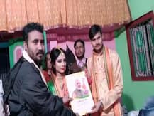 ‘লক্ষ্য ২০২১- টার্গেট বাংলা’! বালুরঘাটে বিয়ের আসরে নবদম্পতিকে প্রচার পুস্তিকা উপহার বিজেপি নেতার