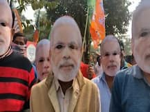 ছবিতে দেখুন-মোদি মুখোশ পরে ‘আর নয় অন্যায়’ কর্মসূচি বাঁকুড়ার বিজেপি কর্মীদের