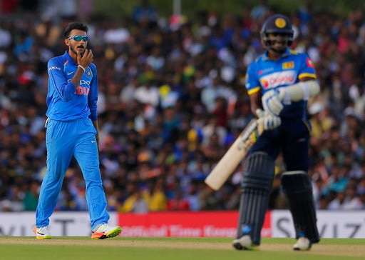 India's Axar Patel, left, reacts after dismissing Sri Lanka's Lakshan Sandakan, right, during their first one-day international cricket match in Dambulla, Sri Lanka, Sunday, Aug. 20, 2017. (AP Photo/Eranga Jayawardena)