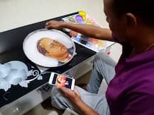 In Pics :  पाण्यावर साकारली डॉ. बाबासाहेबांची रांगोळी, पाहा फोटो