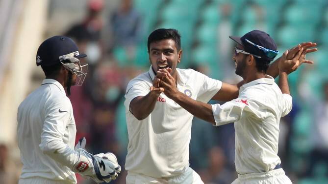 Indian spinner Ravichandran Ashwin, center, celebrates with teammates Ajinkya Rahane, right, and Wriddhiman Saha, as he takes the wicket of South African batsman AB de Villiers, on the third day of the third cricket test match between the two countries in Nagpur, India, Friday, Nov. 27, 2015. (AP Photo/Rafiq Maqbool)