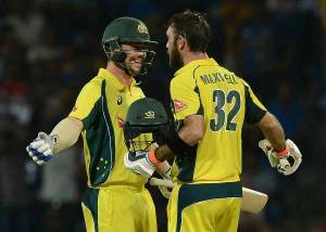 Australia's Glenn Maxwell (R) is congratulated by his teammate Travis Head (L) after scoring a century (100 runs) during the first T20 international cricket match between Sri Lanka and Australia at the Pallekele International Cricket Stadium in Pallekele on September 6, 2016.  / AFP / LAKRUWAN WANNIARACHCHI        (Photo credit should read LAKRUWAN WANNIARACHCHI/AFP/Getty Images)