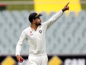 India's captain Virat Kohli directs his players during the second day of their cricket test match against Australia in Adelaide, Australia, Wednesday, Dec. 10, 2014. (AP Photo/James Elsby)