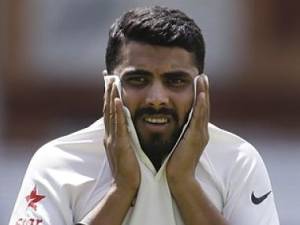 India's Ravindra Jadeja holds his shirt collar during a training session at Lord's cricket ground in London, Wednesday July 16, 2014. England will play India in the second test starting July 17. (AP Photo/Kirsty Wigglesworth)