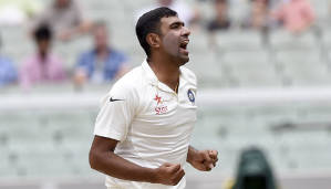 India's Ravichandran Ashwin celebrates trapping Australia's David Warner LBW for 40 runs on the fourth day of their cricket test match in Melbourne, Australia, Monday, Dec. 29, 2014. India are all out for 465 in reply to Australia's first innings of 530. (AP Photo/Andy Brownbill)