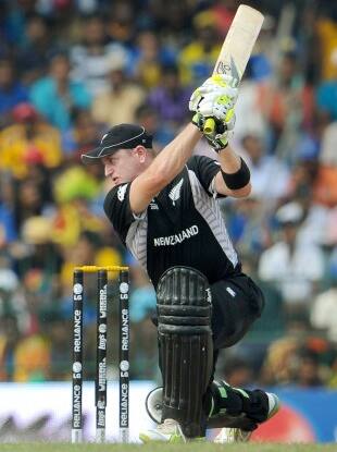 New Zealand batsman Scott Styris (R) drives a ball as Sri Lankan wicketkeeper Kumar Sangakkara (L) looks on in their Cricket World Cup semi-final match played at The R. Premadasa Stadium in Colombo on March 29, 2011. AFP PHOTO/William WEST (Photo credit should read WILLIAM WEST/AFP/Getty Images)